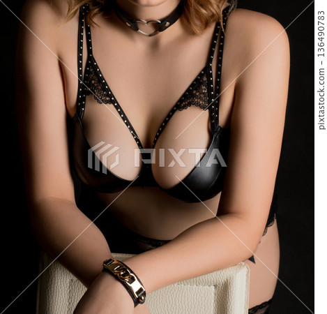 Happy woman in black bra shot in dark Happy woman in black bra shot in dark 136490783