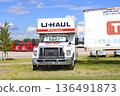 UHAUL  MOVING Truck with blue sky and white clouds outdoor in a parking lot 136491873