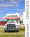 UHAUL  MOVING Truck with blue sky and white clouds outdoor in a parking lot 136491874