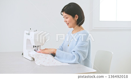 Sewing machine woman image 136492018