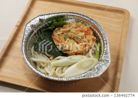 Nabeyaki tempura udon in an aluminum pot before cooking Nabeyaki tempura udon in an aluminum pot before cooking 136492774