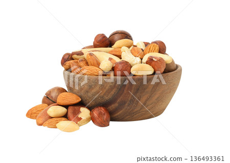 Mixed nuts in a bowl arranged on a white surface, PNG 136493361