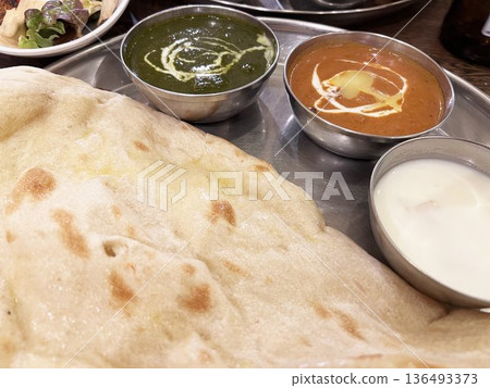 Indian cuisine: Naan, butter chicken and spinach curry set 136493373