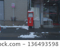 A snow-covered mailbox on a street corner. A quiet everyday winter scene in Japan. 136493598