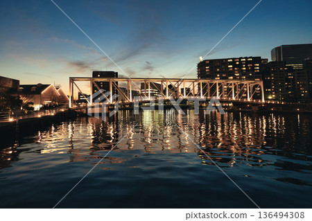 Illuminated bridge over the canal 136494308