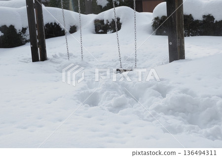 Swings buried in snow 136494311