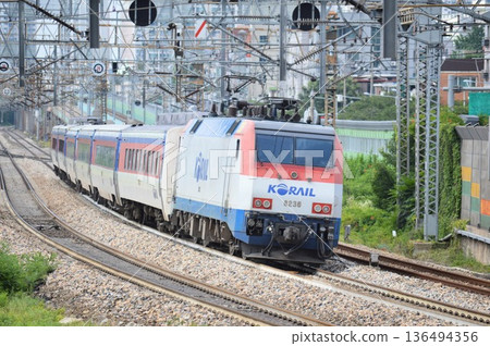 KORAIL Mugunghwa train running KORAIL Mugunghwa train running 136494356