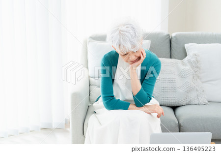 Senior woman thinking about where to move Senior woman thinking about where to move 136495223