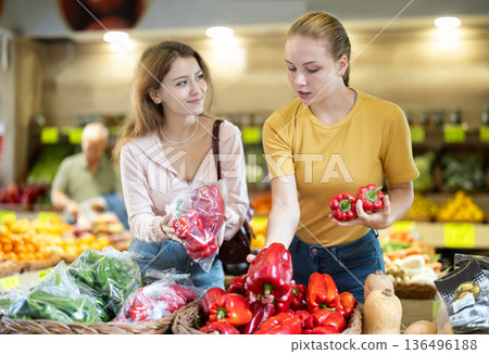 Two female shoppers choosing vegetables and fruits 136496188