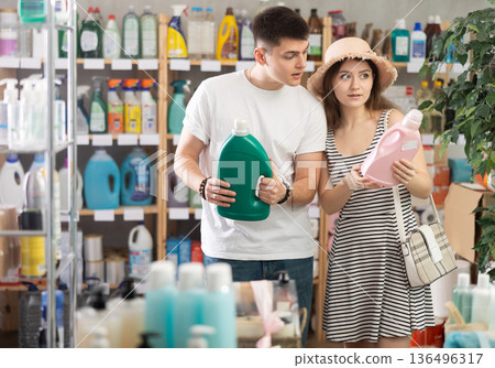 man and a wife choose a detergent man and a wife choose a detergent 136496317