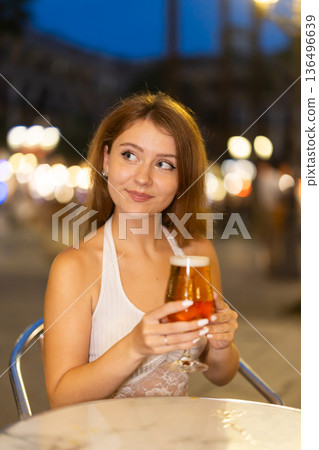 Young woman drinking beer in cafe in Royal Square (Placa Real), Barcelona 136496639