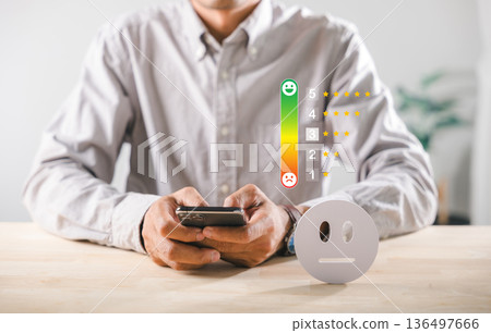 Satisfaction feedback customer service quality survey rating, person rates online experience using mobile phone, choosing neutral face icon for opinion evaluation, showcasing user review digital 136497666