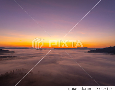 Soft Morning Light and Mist Creating a Dreamlike Mountain Landscape Soft Morning Light and Mist Creating a Dreamlike Mountain Landscape 136498122