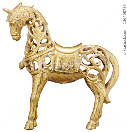 Golden horse figurine with openwork pattern cut out on white background 136498786
