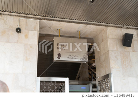 Jakarta Istiqlal Grand Mosque men's entrance sign Jakarta Istiqlal Grand Mosque men's entrance sign 136499413