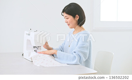Sewing machine woman image Sewing machine woman image 136502202