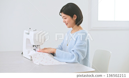 Sewing machine woman image Sewing machine woman image 136502211