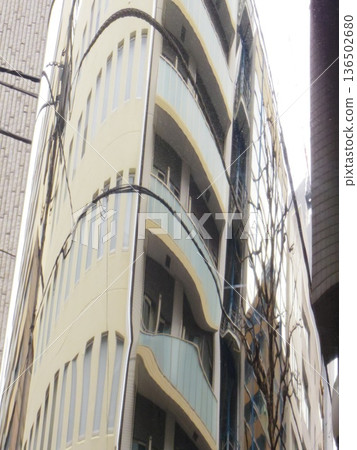 A building reflected on the wall of a building A building reflected on the wall of a building 136502680