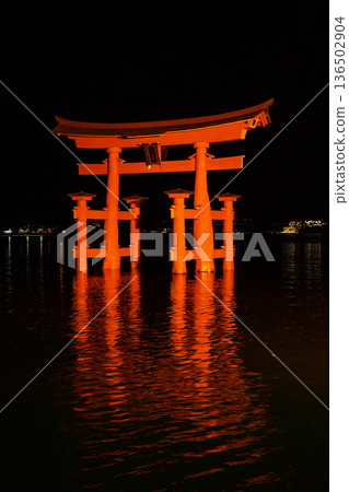 Itsukushima Shrine torii illuminated at night on Miyajima island 136502904