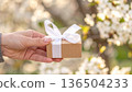 Men's hand with gifts 136504233