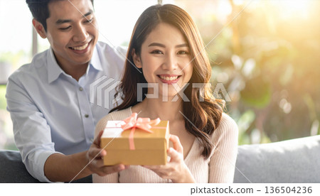 Women who are pleased to receive a present 136504236