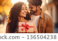 A couple giving gifts 136504238