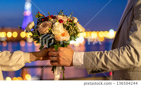 Hand with flowers 136504244