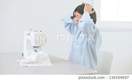 Sewing machine woman image 136504697