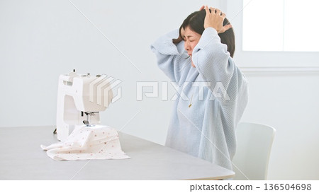 Sewing machine woman image Sewing machine woman image 136504698