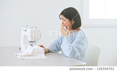 Sewing machine woman image Sewing machine woman image 136504701