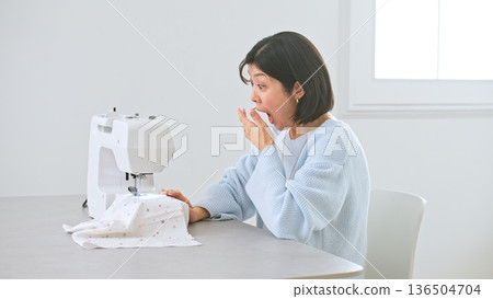 Sewing machine woman image 136504704