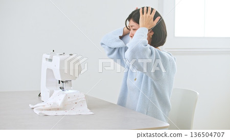 Sewing machine woman image Sewing machine woman image 136504707