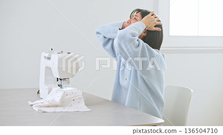 Sewing machine woman image 136504710