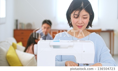 Sewing machine woman image 136504723