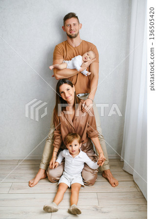 Happy Family Portrait With Baby And Toddler 136505420
