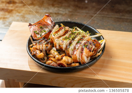 Grilled squid: A deliciously grilled seafood dish from a street stall Grilled squid: A deliciously grilled seafood dish from a street stall 136505878