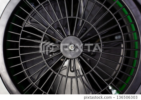 The inside of heater with fan. Close-up photo of the heater components. Heater and fan for home. Concept for ventilation and airing room. Heater and fan in one device. Focus on the protective panel The inside of heater with fan. Close-up photo of the heater components. Heater and fan for home. Concept for ventilation and airing room. Heater and fan in one device. Focus on the protective panel 136506303
