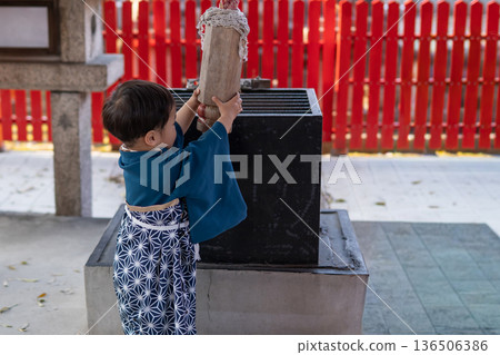 A child in a hakama visiting a shrine for Shichi-Go-San A child in a hakama visiting a shrine for Shichi-Go-San 136506386