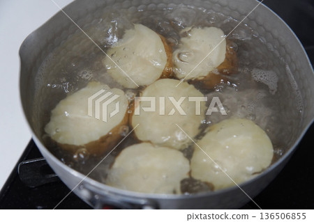 Boiling potatoes with cuts Boiling potatoes with cuts 136506855