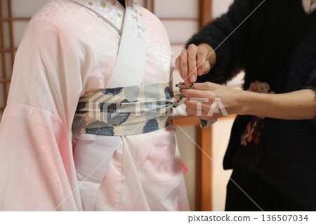 A woman wearing a kimono 136507034
