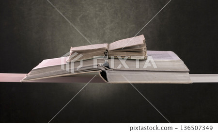 Still life with old books on a shelf Still life with old books on a shelf 136507349