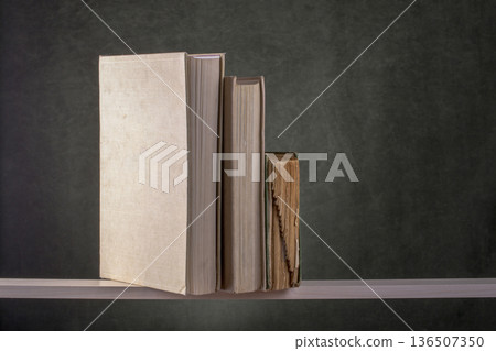 Still life with old books on a shelf Still life with old books on a shelf 136507350