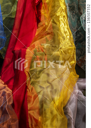 Abstract background made of colored fabric scraps 136507352