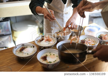 A woman making shrimp porridge A woman making shrimp porridge 136508109