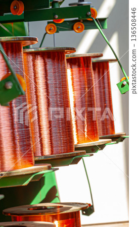Copper wire spools in a factory during the day showing industrial production process 136508446