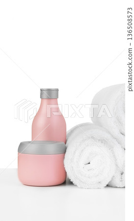Spa setup with pink containers and white towels on a clean surface Spa setup with pink containers and white towels on a clean surface 136508573