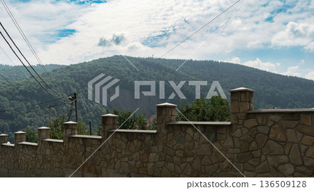 Mountain Village Fence and Wooden House with Forest Hills View Mountain Village Fence and Wooden House with Forest Hills View 136509128