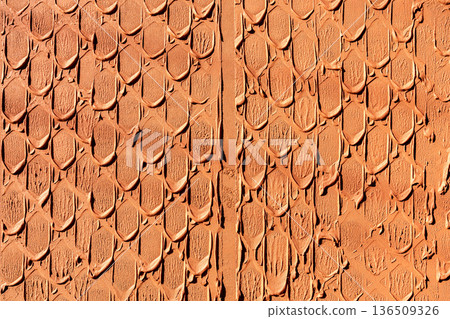 Patterned reddish-brown wall 136509326