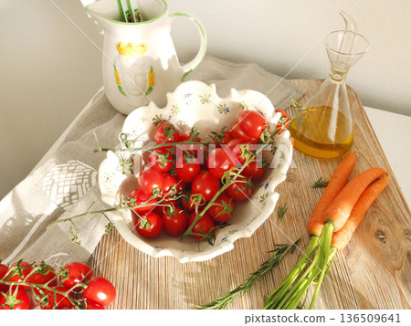 Fresh cherry tomatoes in vintage bowl on wooden board. Food and agricultural products. Healthy food and vegetables.  136509641