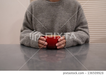 A woman with a mug A woman with a mug 136509928